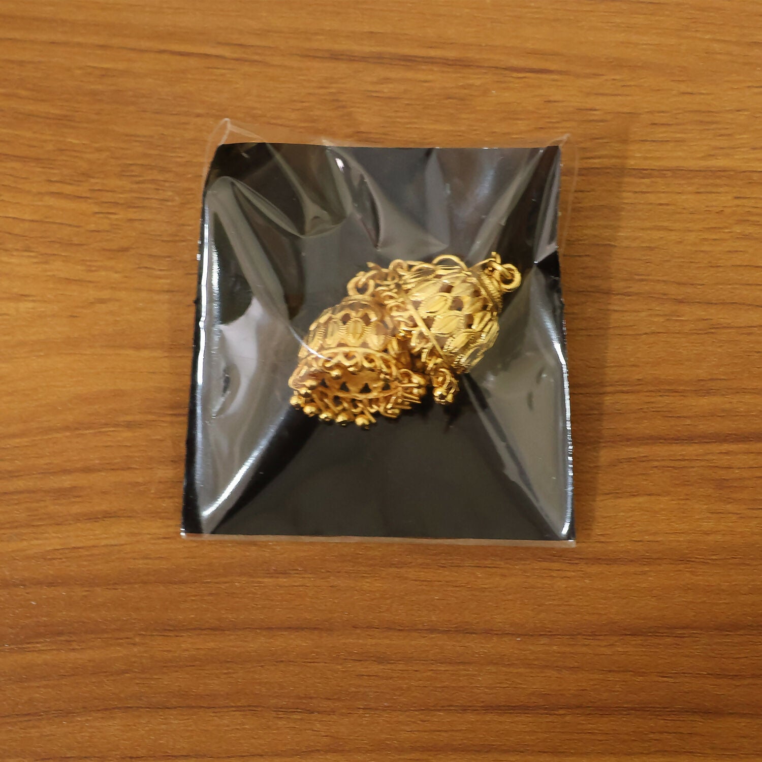Traditional Gold-Finish Jhumka with Intricate Cutwork Design