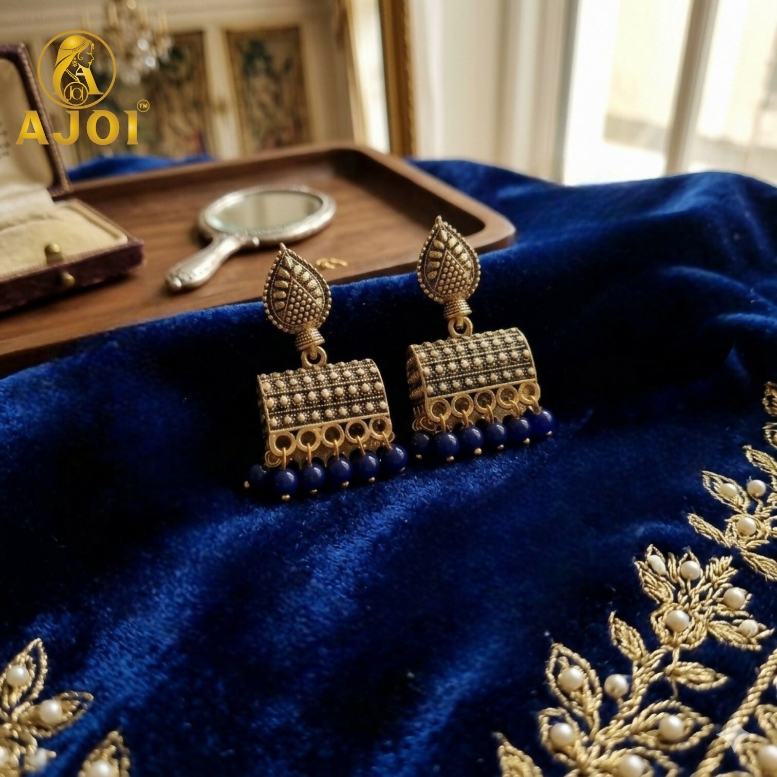 Antique Gold-Plated Leaf Design Jhumka Earrings with Blue Beads