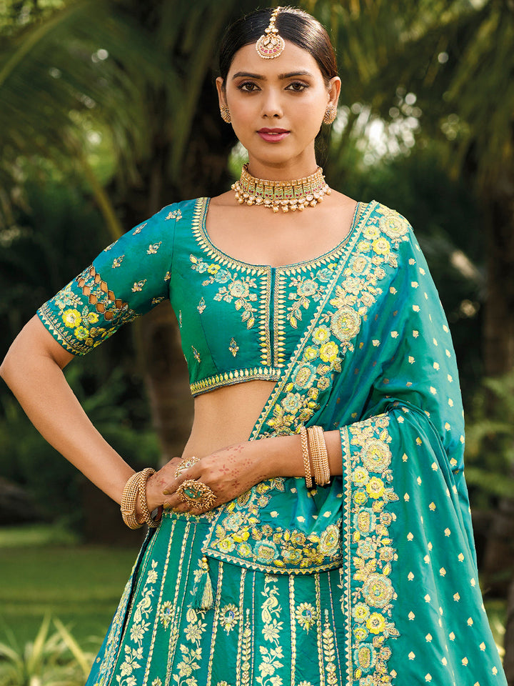 Teal Banarasi Silk Heavy Embroidered Cut Work Semi Stitched Lehenga Choli - qivii