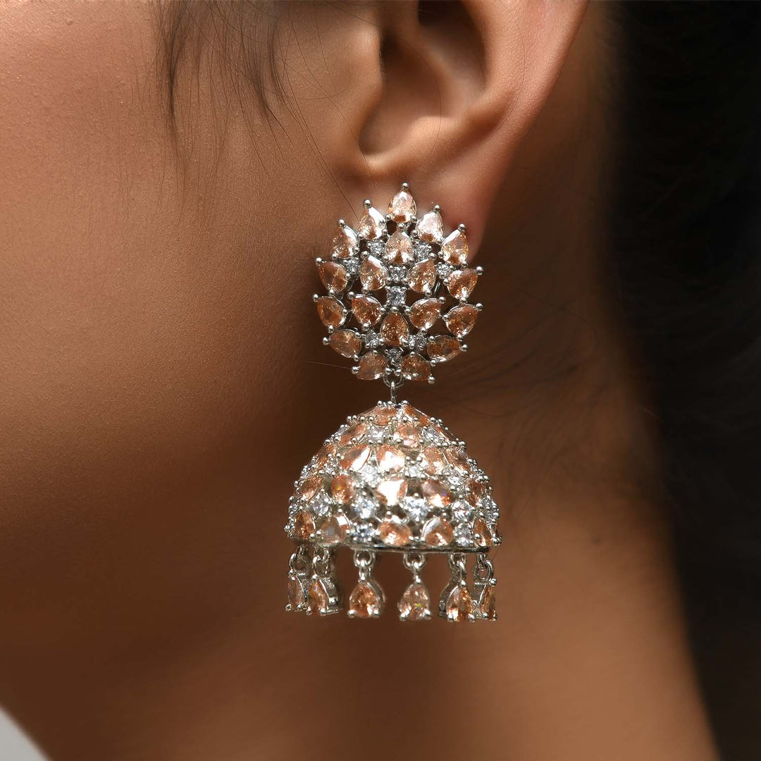 Elegant jhumka earrings with silver plating, American diamond, and copper stone