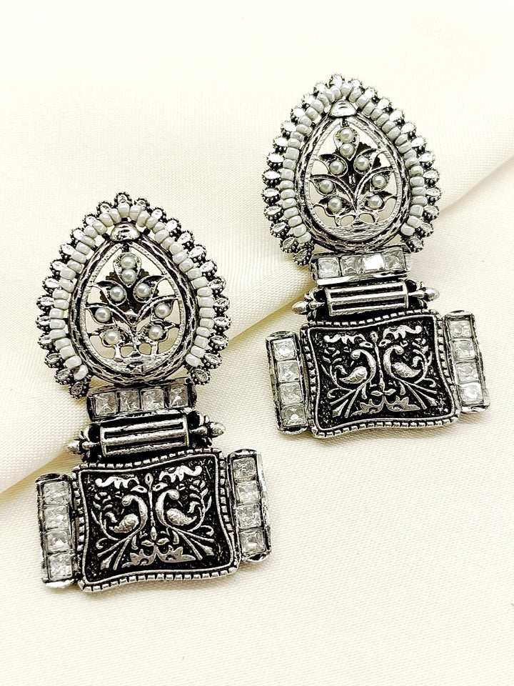 Jinisha White Boutique Earrings crafted with silver plated brass metal, adorned with delicate Kundan stone, perfect for any occasion