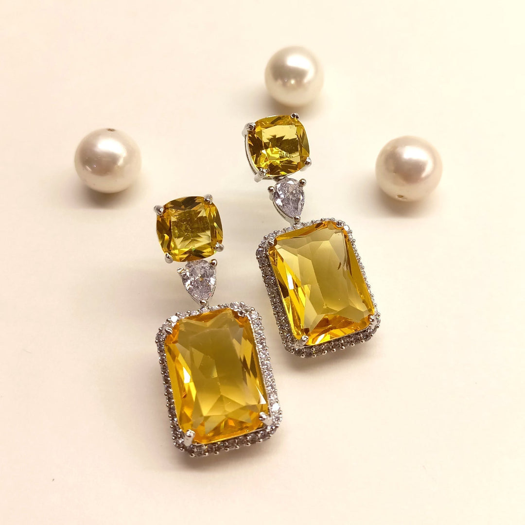 Beautiful and stylish studded American diamond and yellow stone earrings 