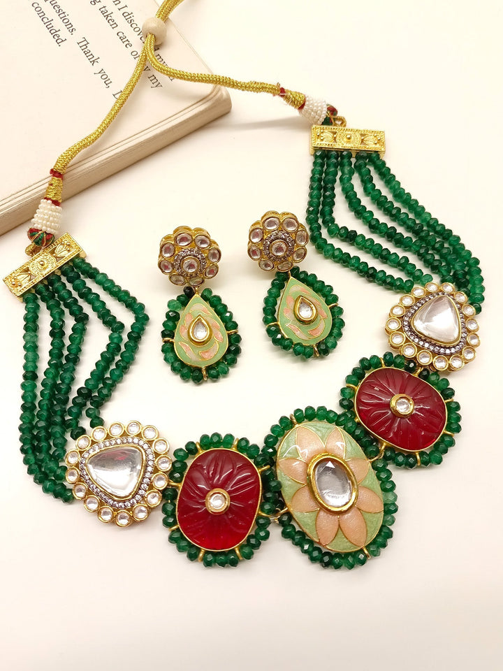 Gold and green Meenakari choker set with intricate traditional design