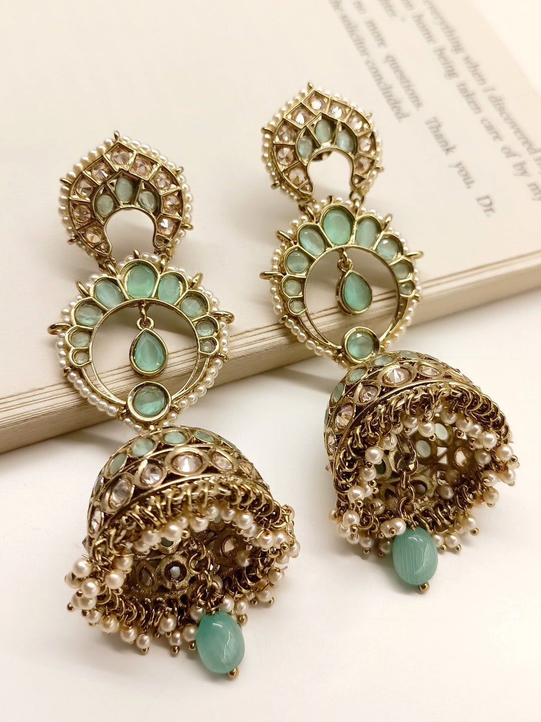Marlee Mint Green Polki Jhumki earrings with antique gold plated brass metal and stunning pearl hanging