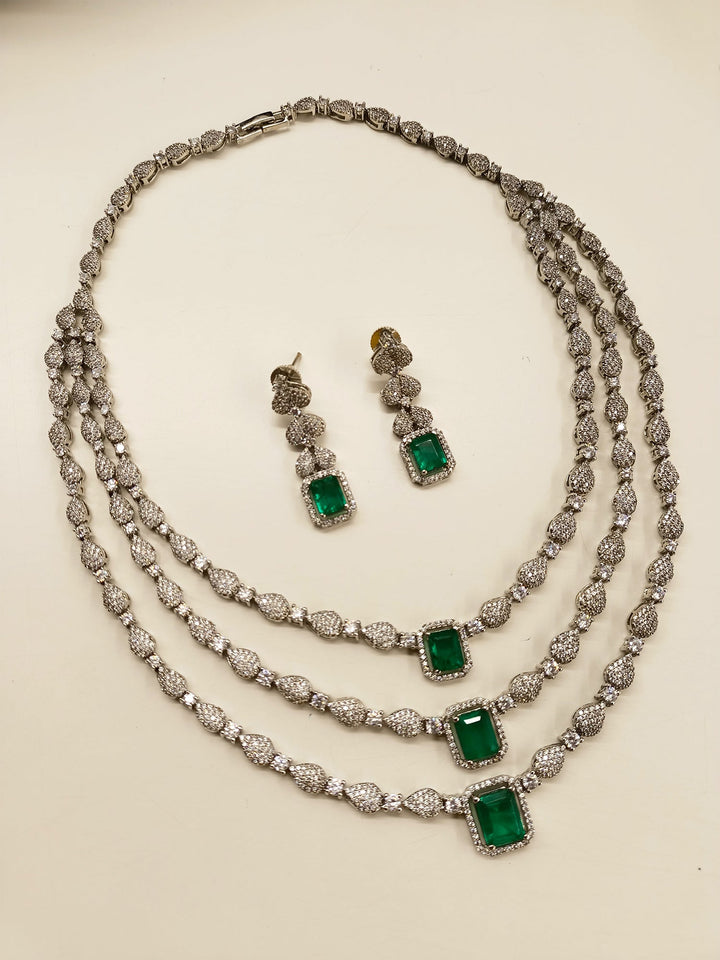  Elegant silver necklace set with emerald stone and brass metal base