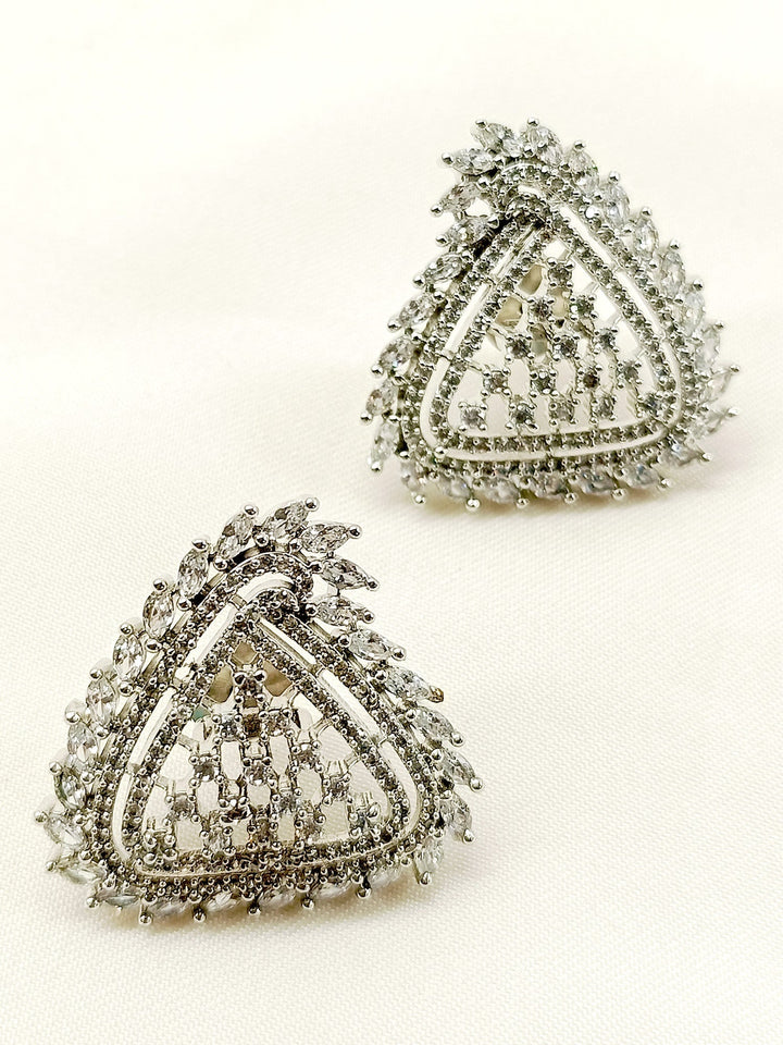 Close-up of silver plated brass metal stud earrings with delicate American diamonds 