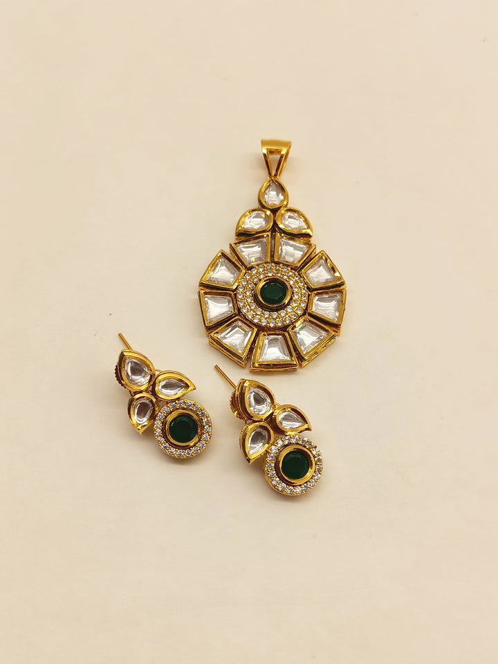Gold plated Kundan pendant set with green stones and intricate detailing