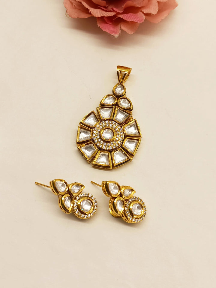  Gorgeous Purnima White Kundan Pendant Set adorned with intricate Kundan setting and elegant gold-plated brass tops