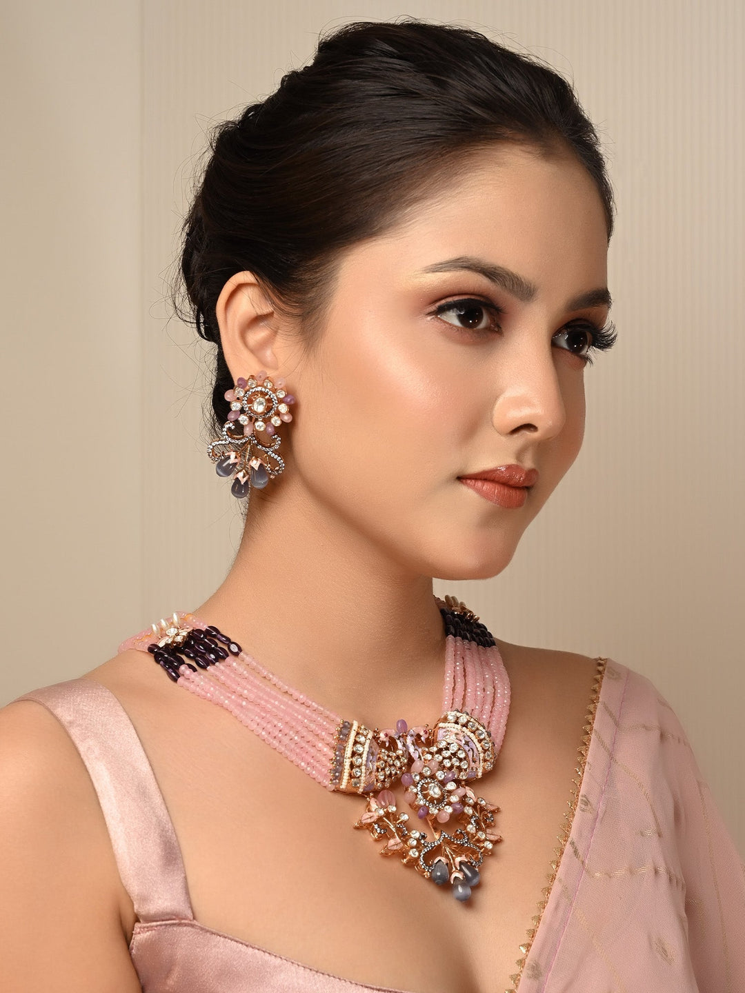 Madhurima Pink Peacock Kundan Necklace Set crafted from gold plated brass metal with multiple layered beads chain and intricate peacock motifs 