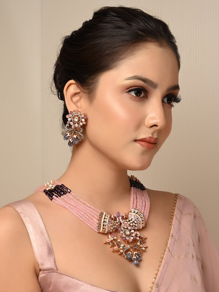 Madhurima Pink Peacock Kundan Necklace Set crafted from gold plated brass metal with multiple layered beads chain and intricate peacock motifs 
