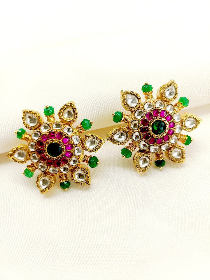 Two gold-plated brass metal Kundan tops with intricate designs and timeless elegance 