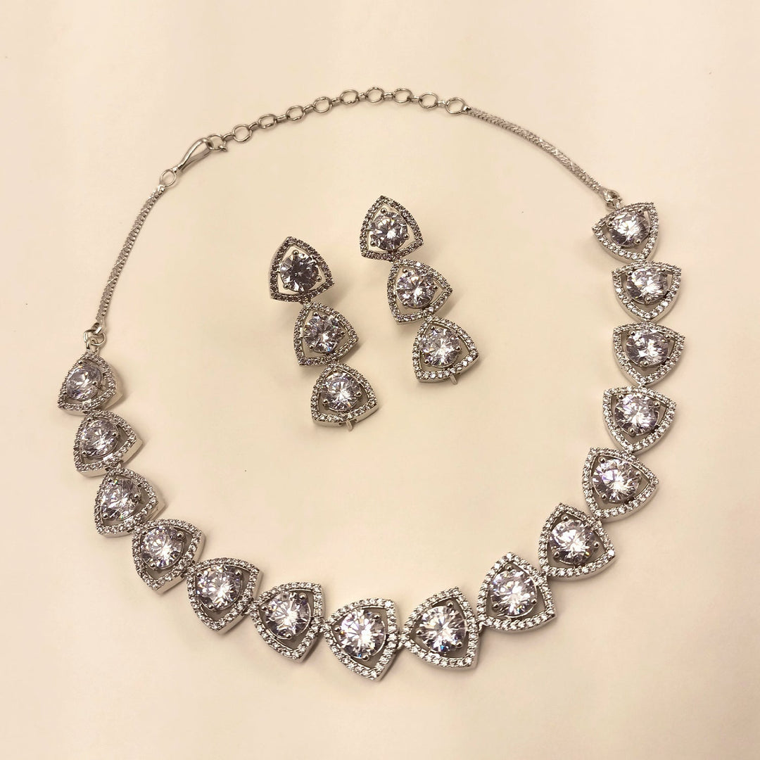  Exquisite Zaara Silver Plated Semiprecious White Stone American Diamond set with detailed silver plating and dazzling American Diamond embellishments