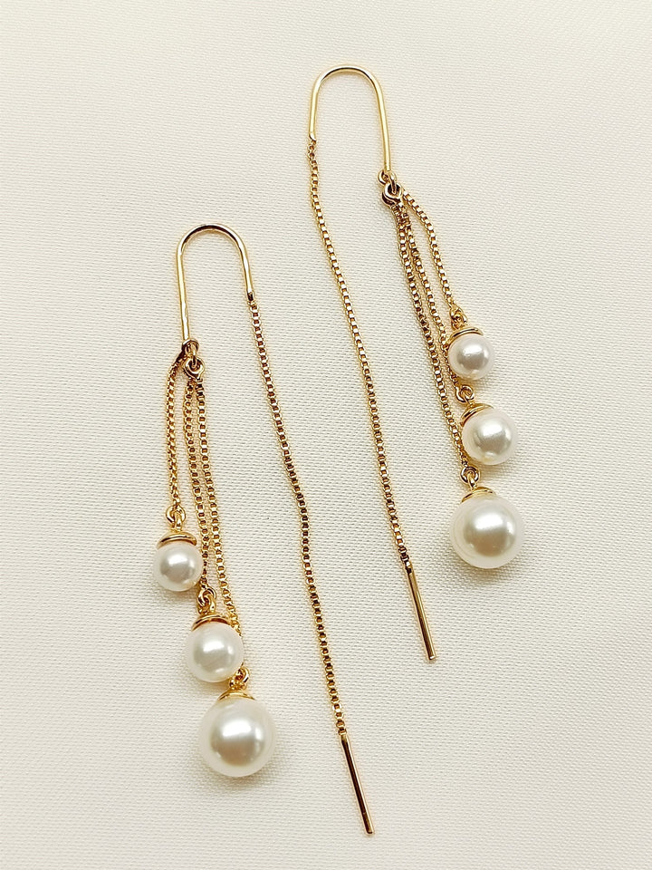Hanging gold plated brass Sui Dhaga pearl earrings with elegance 