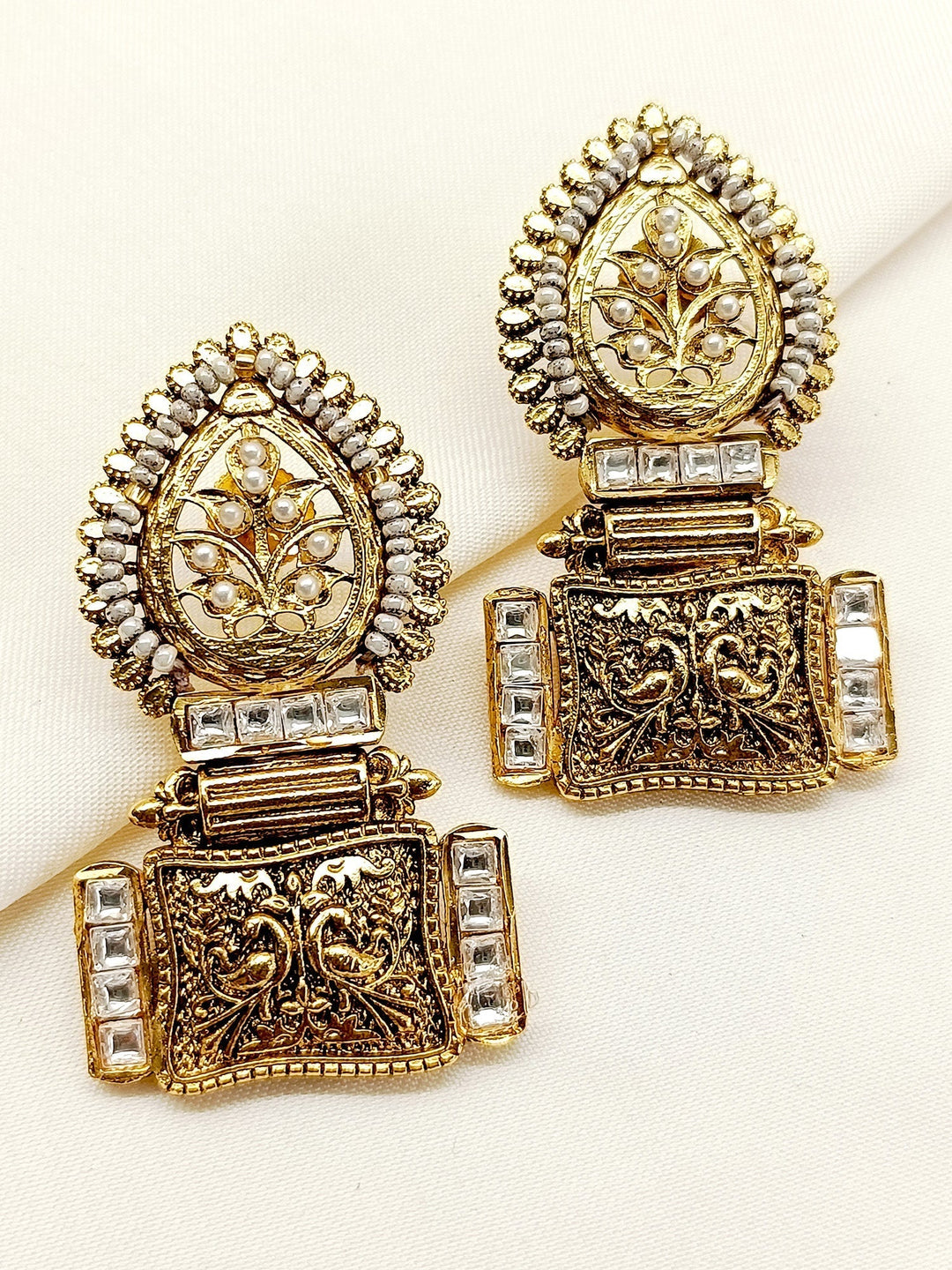 Gold plated brass metal earrings with delicate Kundan stone detail