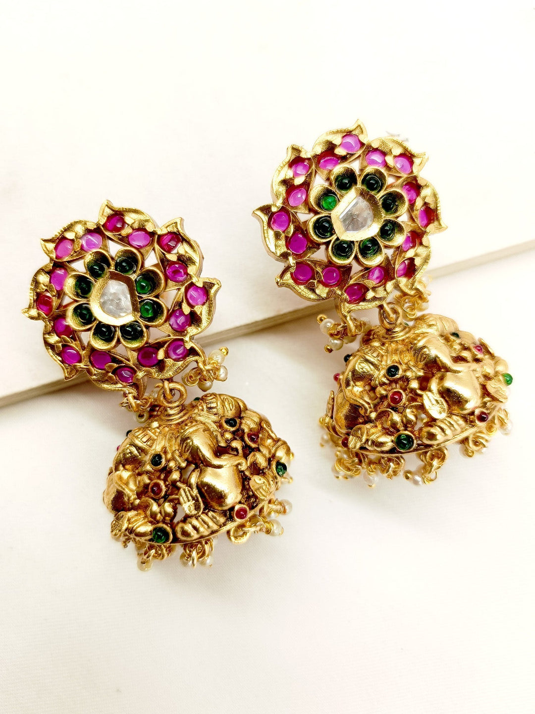Gold plated brass metal antique jhumki with intricate temple motifs 