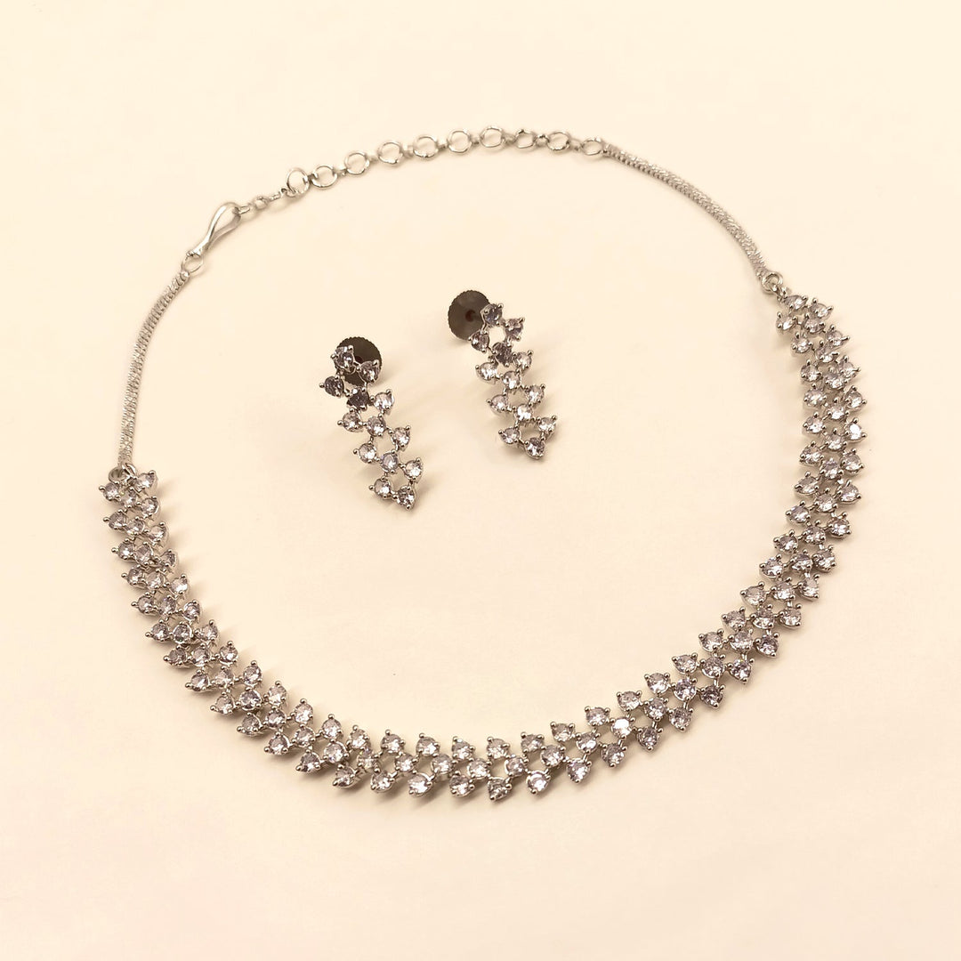  Exquisite Tejaswini Silver Plated Semiprecious White Stone American Diamond set featuring delicate silver plating on brass metal