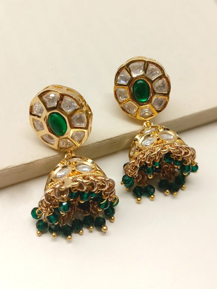 Kimora Green Kundan Jhumki crafted from gold plated brass with delicate green bead hanging, perfect traditional accessory 