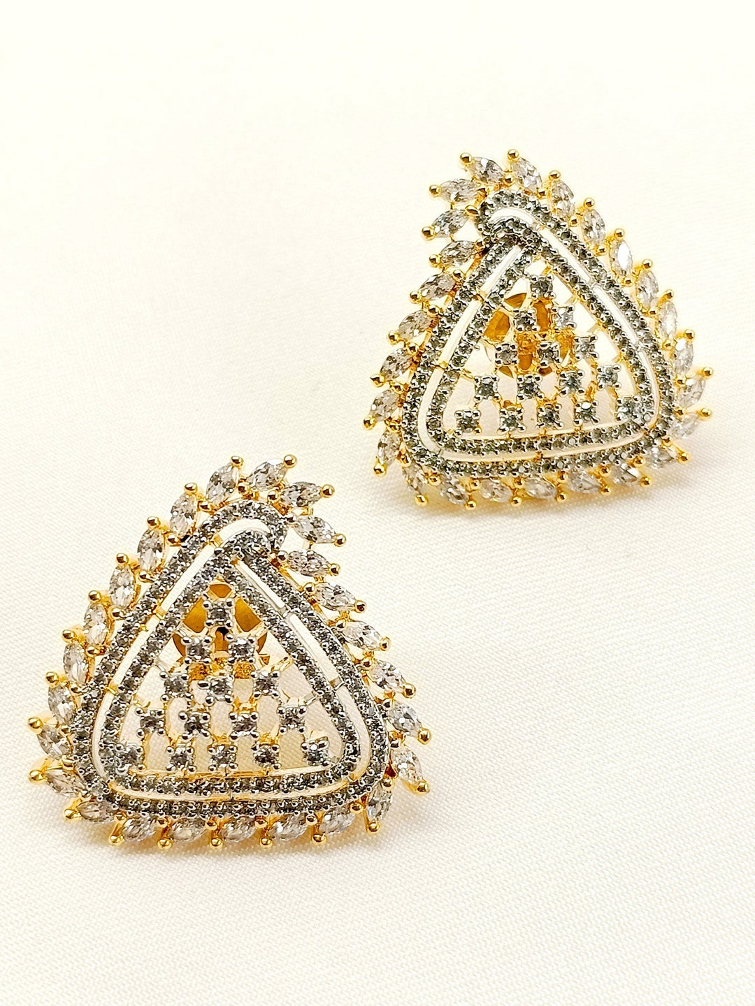 Close-up of Lovemallow White American Diamond Tops with gold plated brass metal and delicate American Diamonds, perfect for any elegant occasion Elevate your style with these exquisite jhumkis