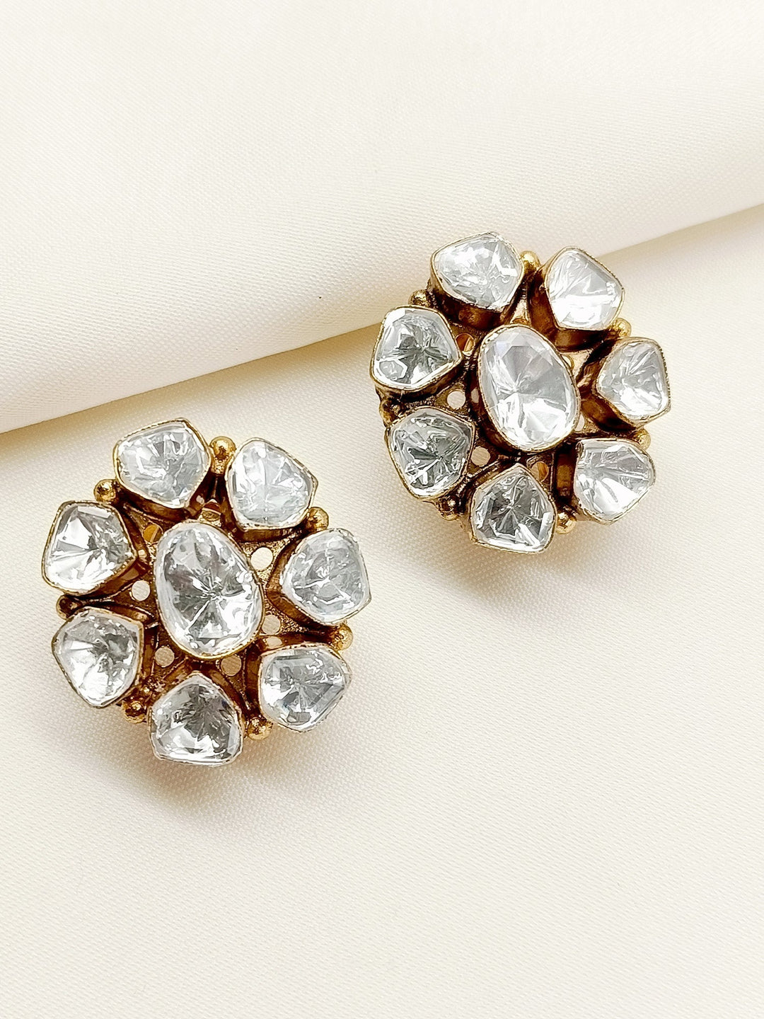 Pair of elegant White Kundan Tops with American Diamonds and back clip-on feature, crafted in gold plated brass metal 