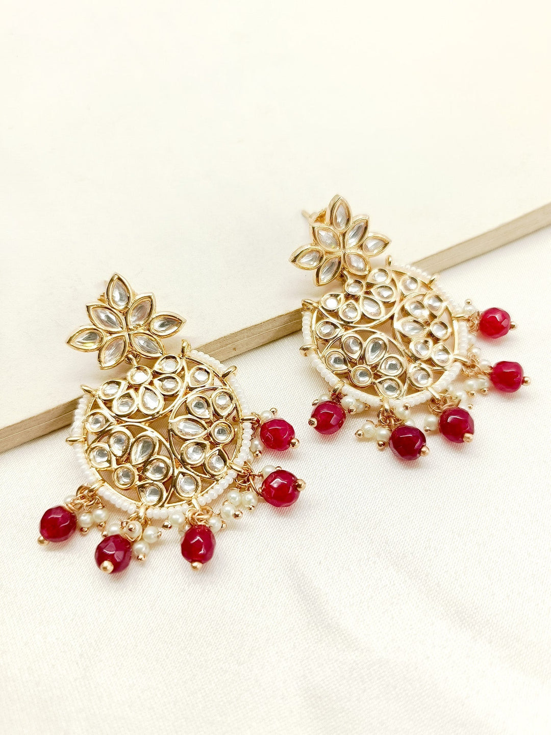 Exquisite Anabia Maroon Kundan Earrings with intricate gold detailing and hanging pearls