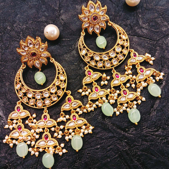 Elegant and sophisticated rose pink and mint green Kundan earrings with small pearl beads and mint green oval stones hangings