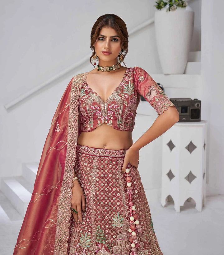 Pinkish Red Bridal Lehenga With Temple & Cow Motifs - qivii