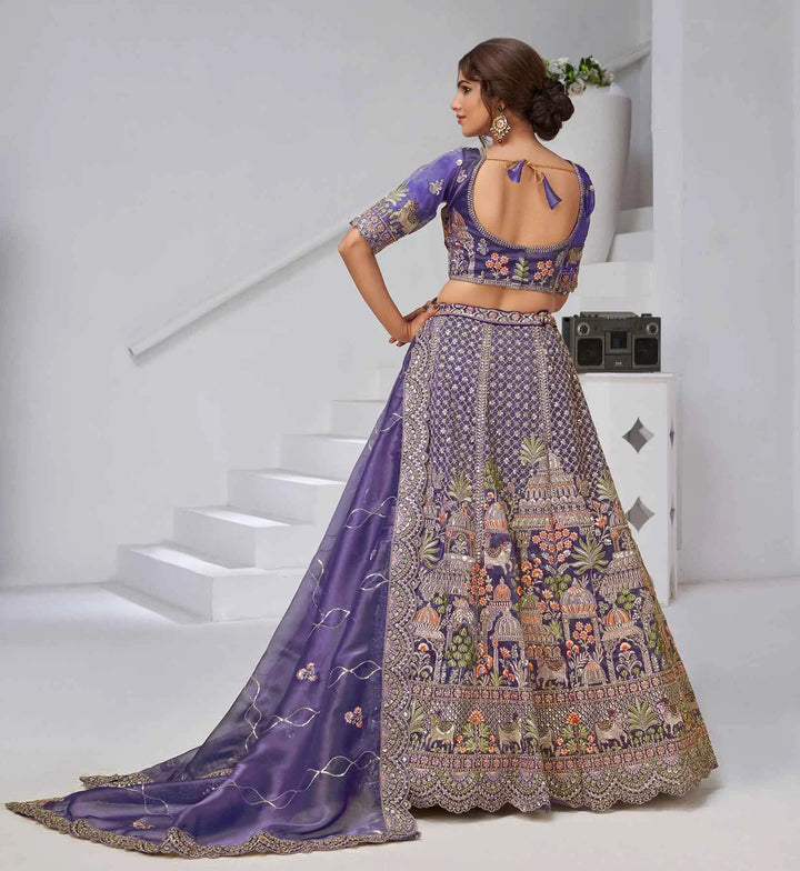 Bluish Purple Bridal Lehenga With Temple & Cow Motifs - qivii
