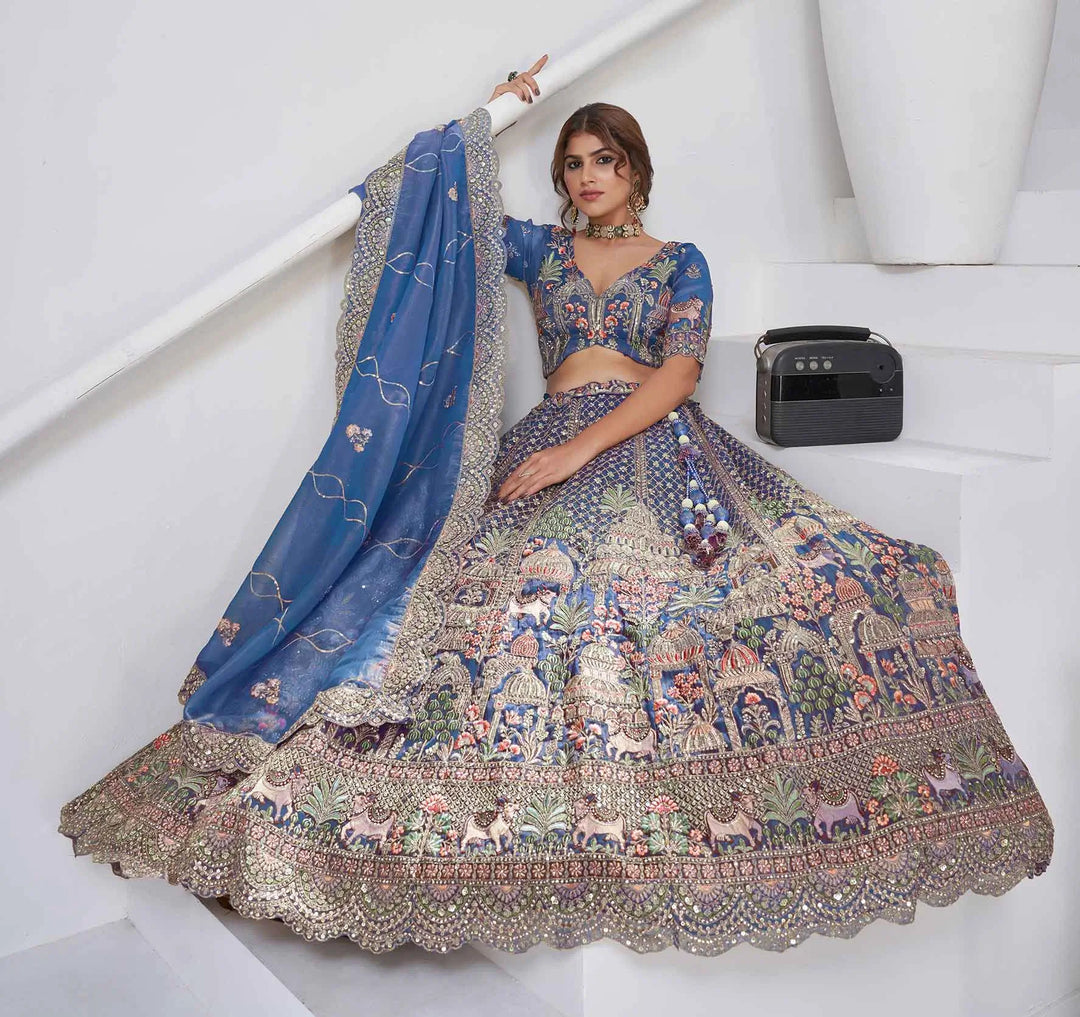 Dusty Blue Bridal Lehenga With Temple & Cow Motifs - qivii