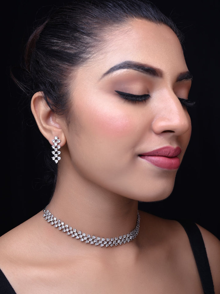 Close up view of Tejaswini Silver Plated Semiprecious White Stone American Diamond set with intricate silver plating on brass metal