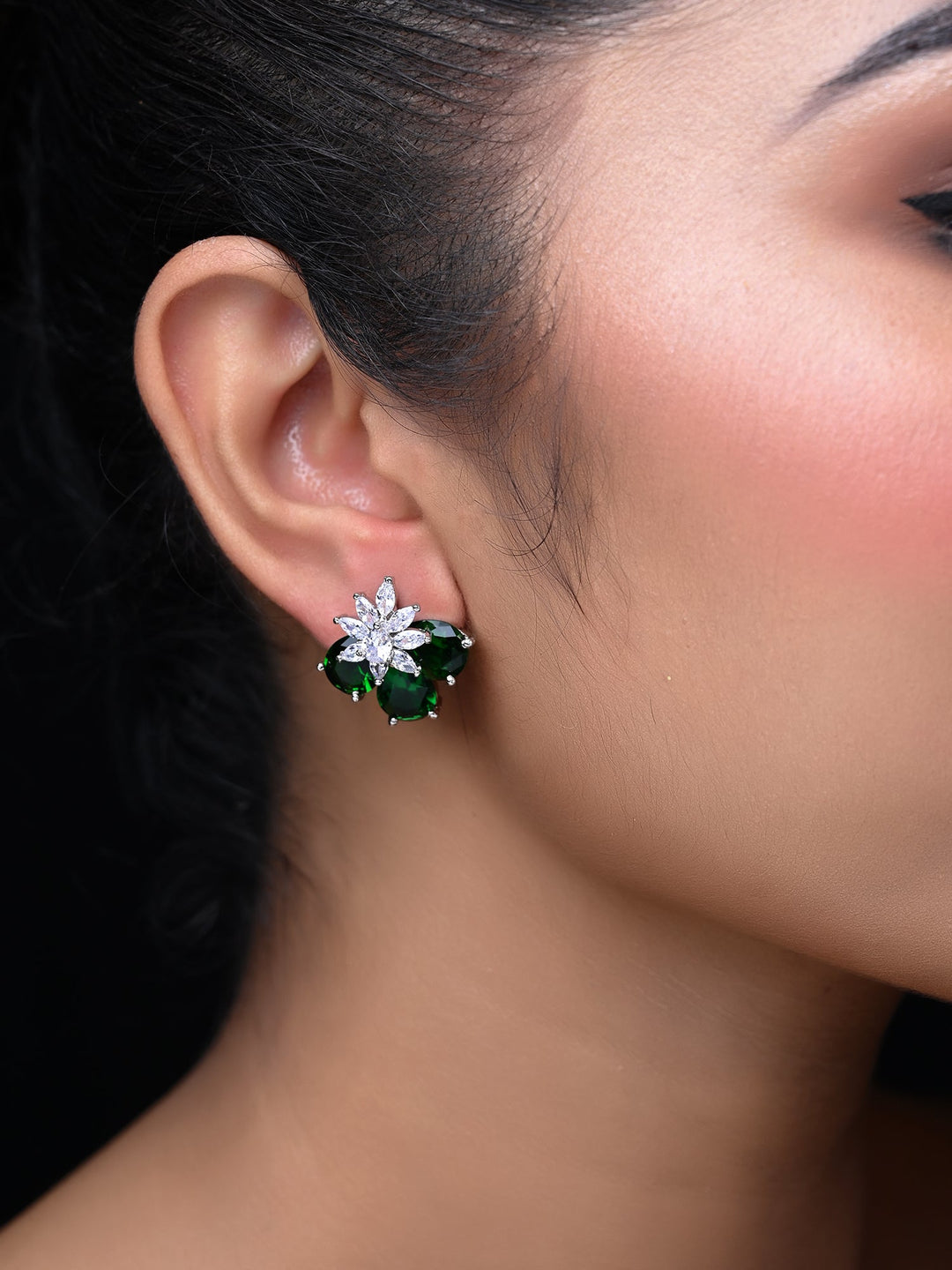  Beautiful and elegant green emerald stone studs on trendy American diamond tops 