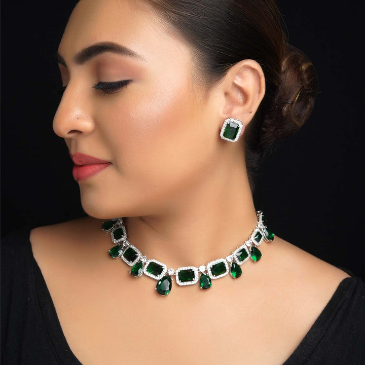 Silver plated necklace set with green emerald stones and diamonds 