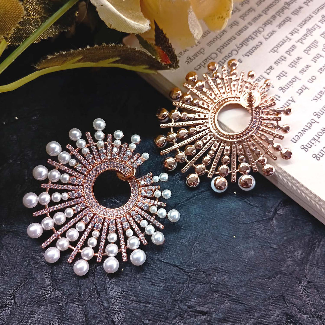 Beautiful rose plated pearl tops with sparkling American Diamond details