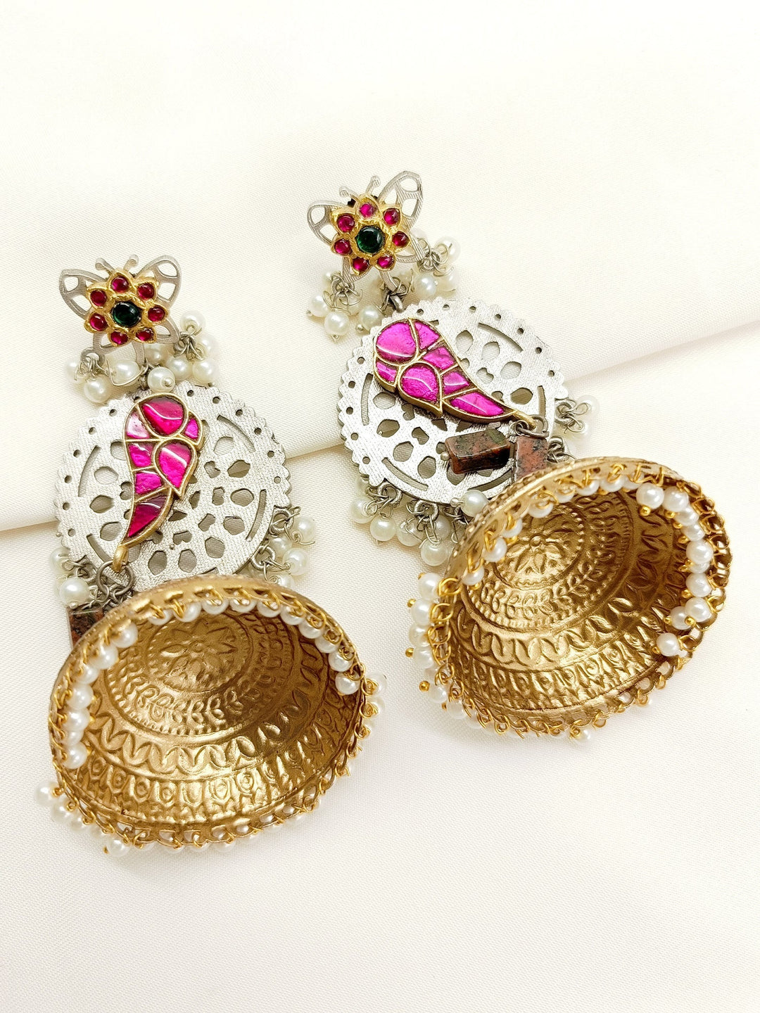 Gold plated brass metal boutique jhumki with traditional designs and delicate pearl hangings