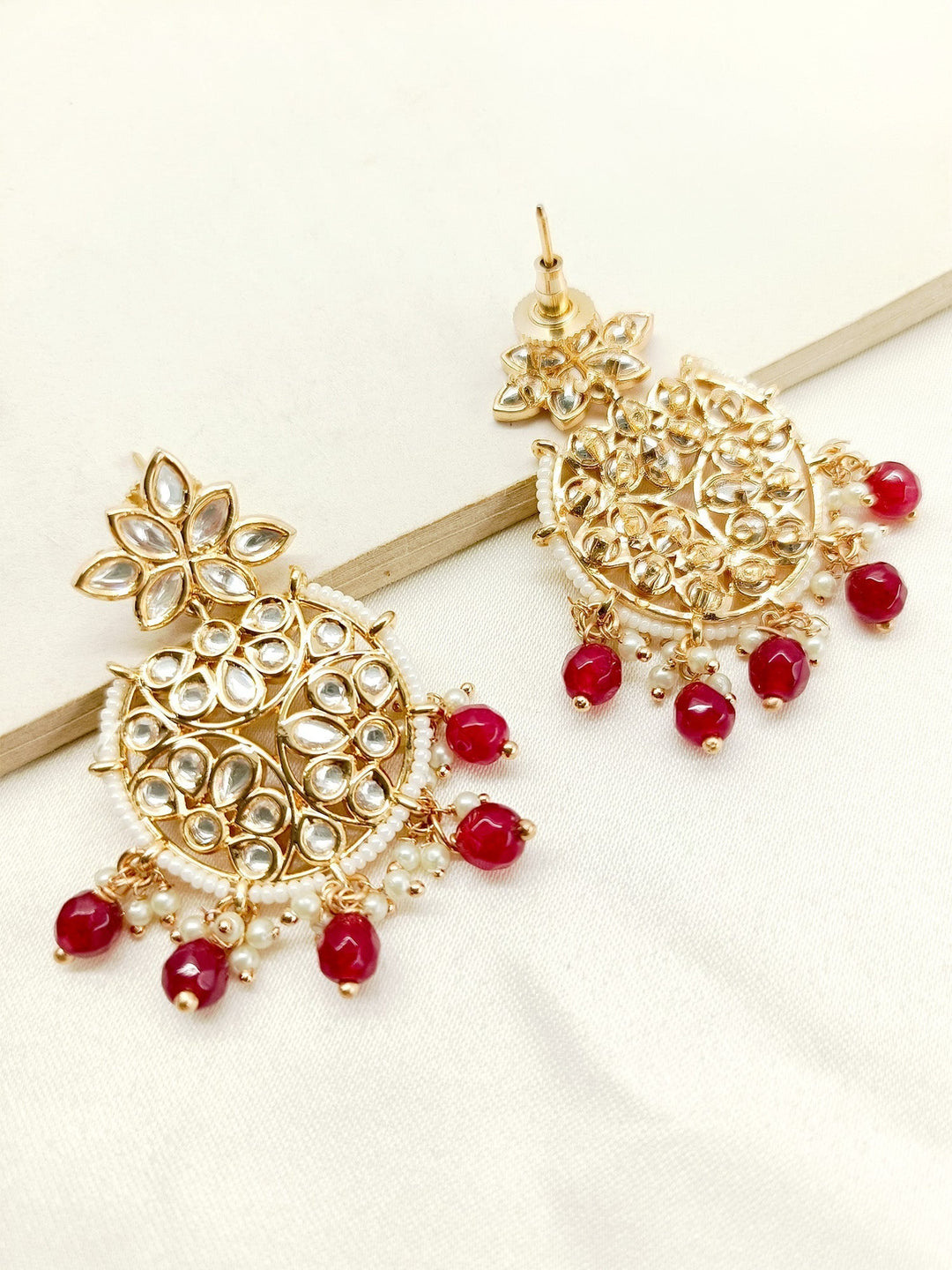 Exquisite Anabia Maroon Kundan Earrings with intricate gold detailing and dangling pearls