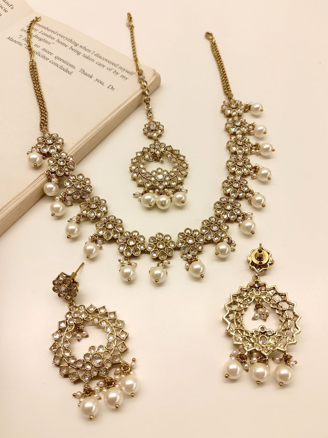 Anokhi White Polki Necklace Set with intricate floral design and sparkling gemstones