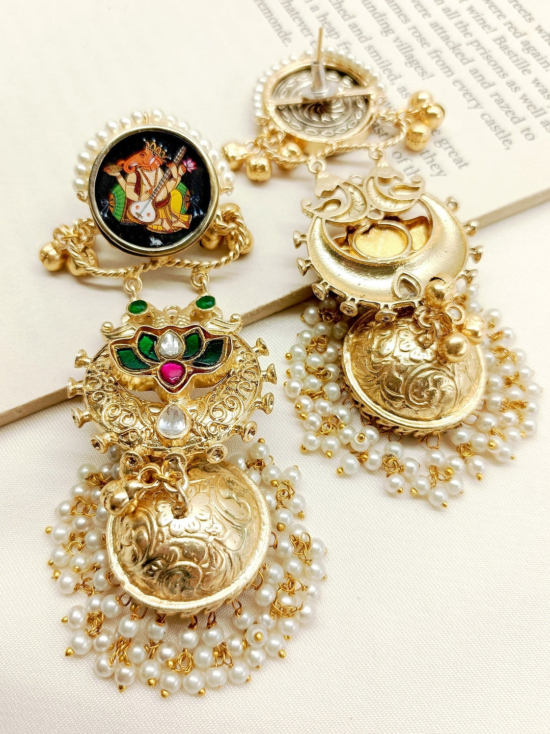 Gold and silver traditional Indian jhumki earrings from Kanika M & G Boutique