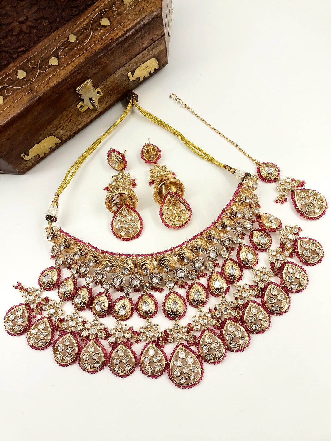 Stunning Kundan necklace, earrings, and teeka set for a bride-to-be

