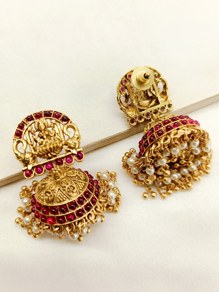 Gold plated antique temple jhumki earrings with rose pink stone detailing