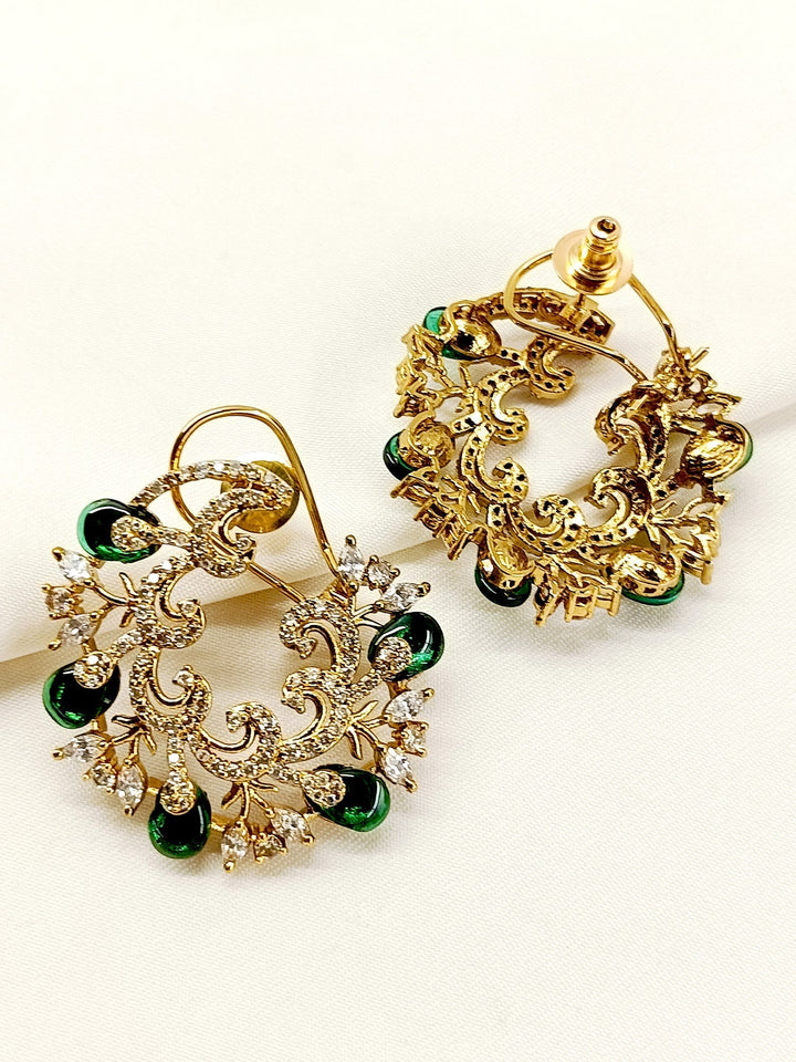 These Mantania Green Kundan Tops are exquisitely crafted with traditional techniques and gold plated brass metal, featuring a delicate American Diamond Stones back clip-on Elevate your style with these elegant earrings