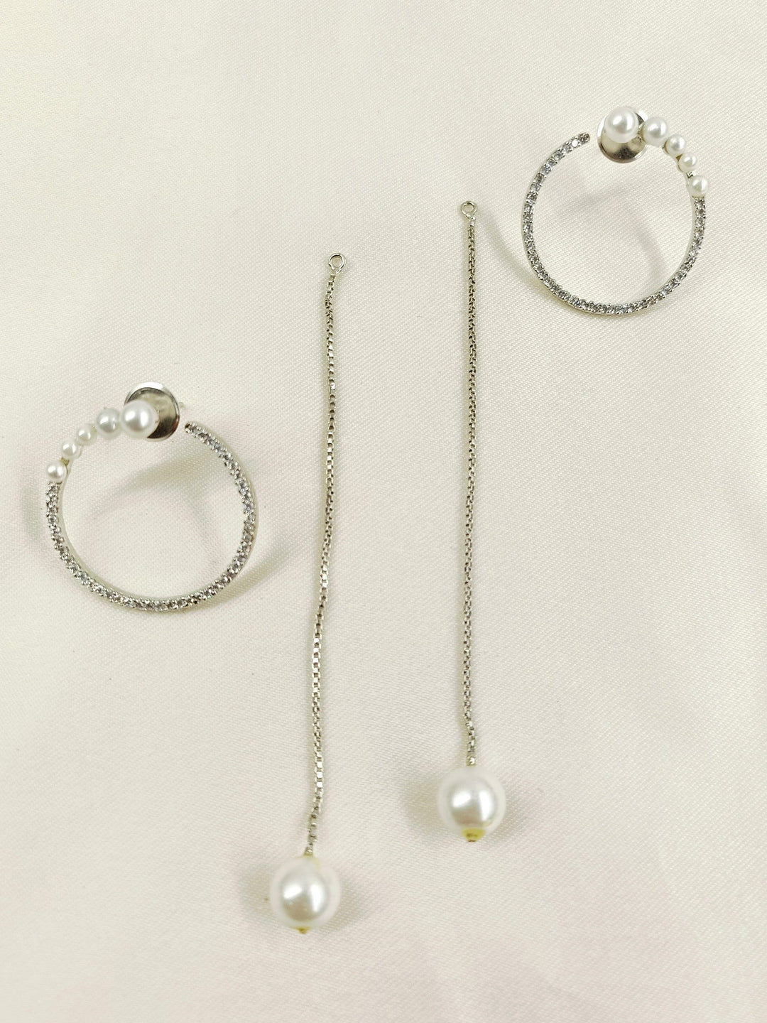 Stunning American diamond earrings with a unique style and delicate pearl detailing