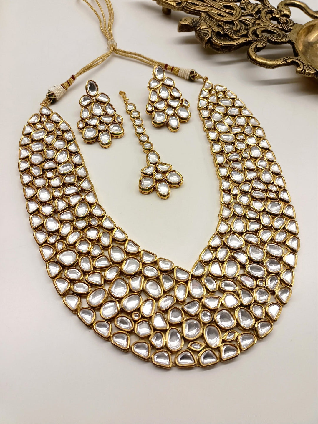 Sanober Kundan Necklace Set with intricate gold detailing and colorful gemstones