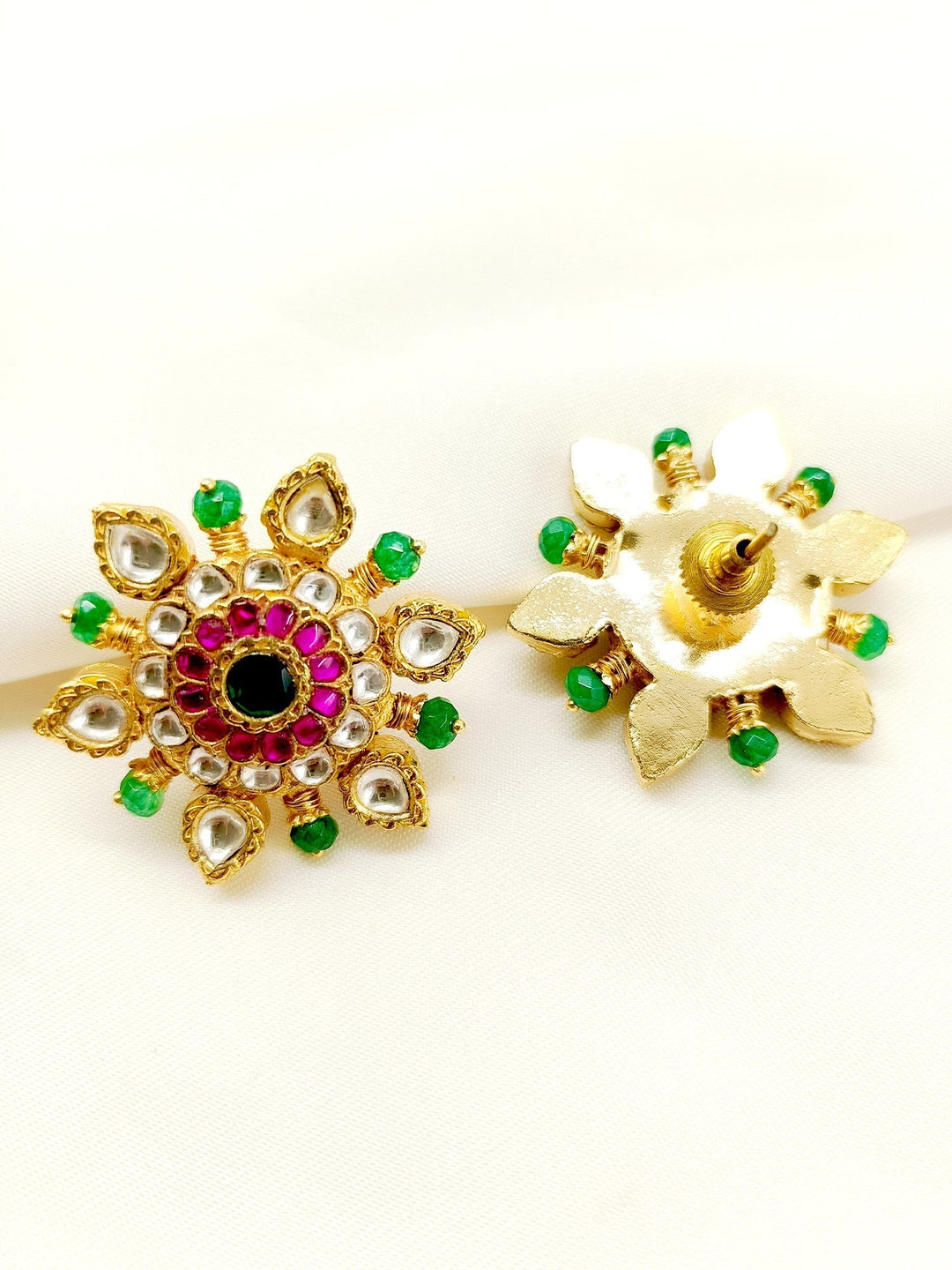  A pair of traditional Kundan tops crafted from high-quality materials for a touch of sophistication