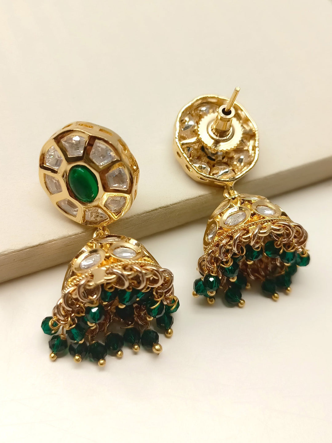  Elegant and intricate Kimora Green Kundan Jhumki with gold plated brass and delicate green bead hanging