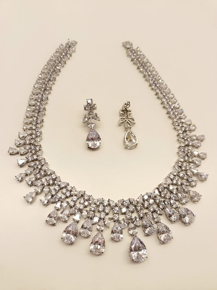 Exquisite White American Diamond Necklace Set made with silver plated brass metal, emitting undeniable sparkle and brilliance, perfect for any special occasion