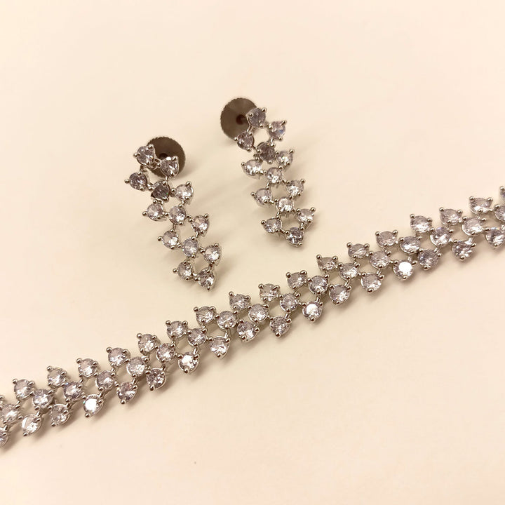  Elegant American Diamond set with stunning white stones and intricate silver plating on brass metal