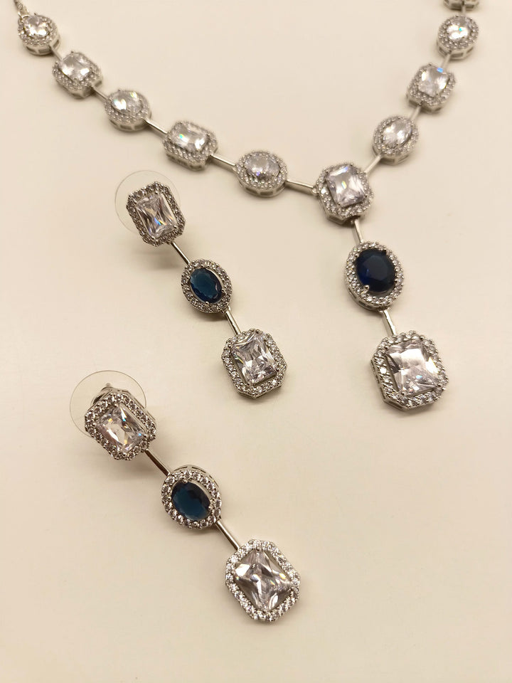Silver plated necklace set featuring blue sapphire and American diamond