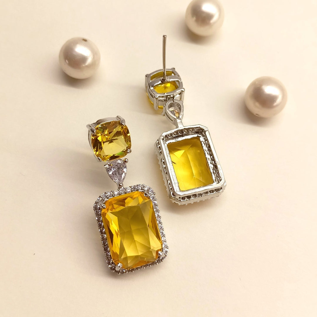  Elegant silver-plated brass metal earrings with AD and fancy cut stones 