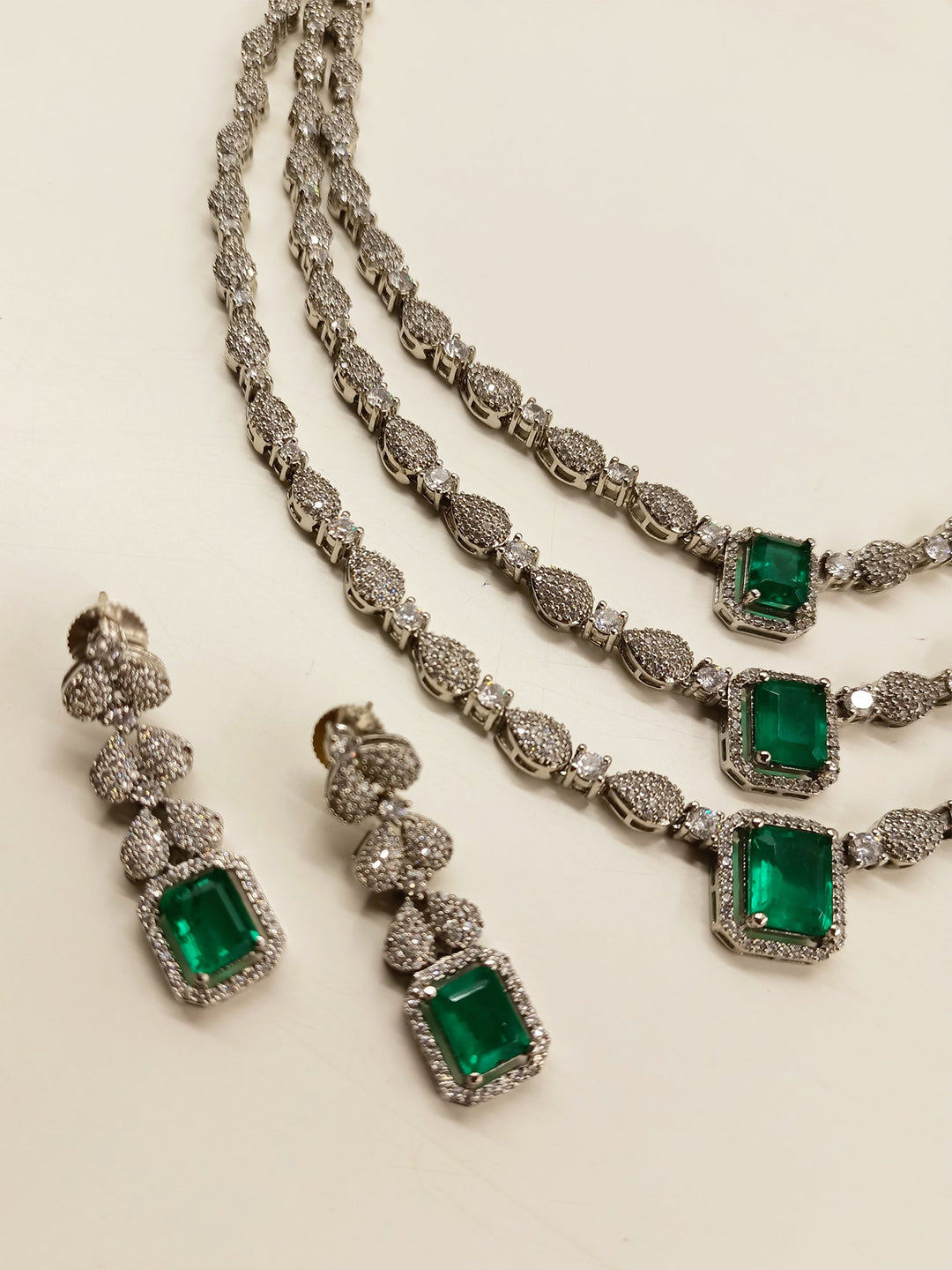  Silver plated brass metal necklace set with three layers of emerald stones
