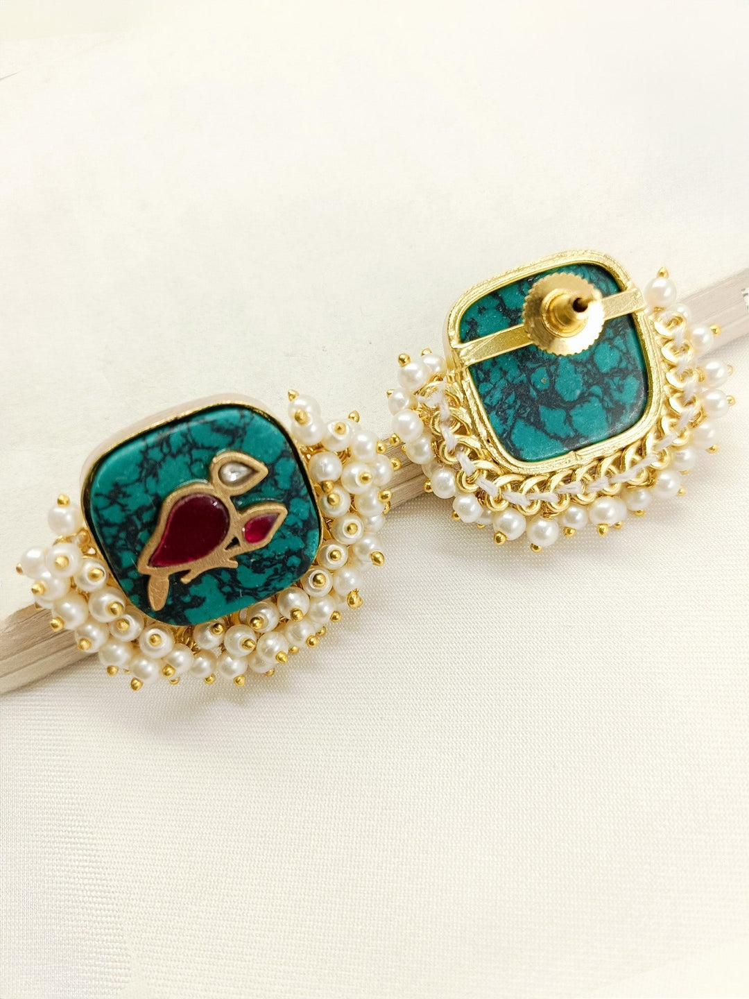 Traditional and stylish boutique top crafted from gold plated brass metal with intricate pearl detailing and bird motifs