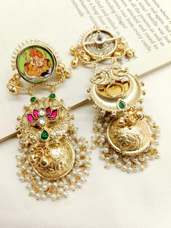 Handcrafted gold and silver jhumki earrings by Nova M & G Boutique